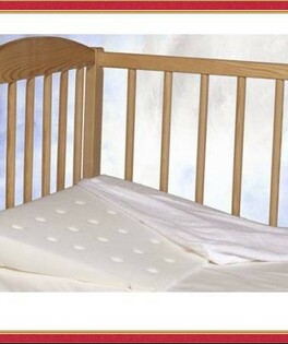 Poduszka dla niemowląt Klin z nawleczką MATEX